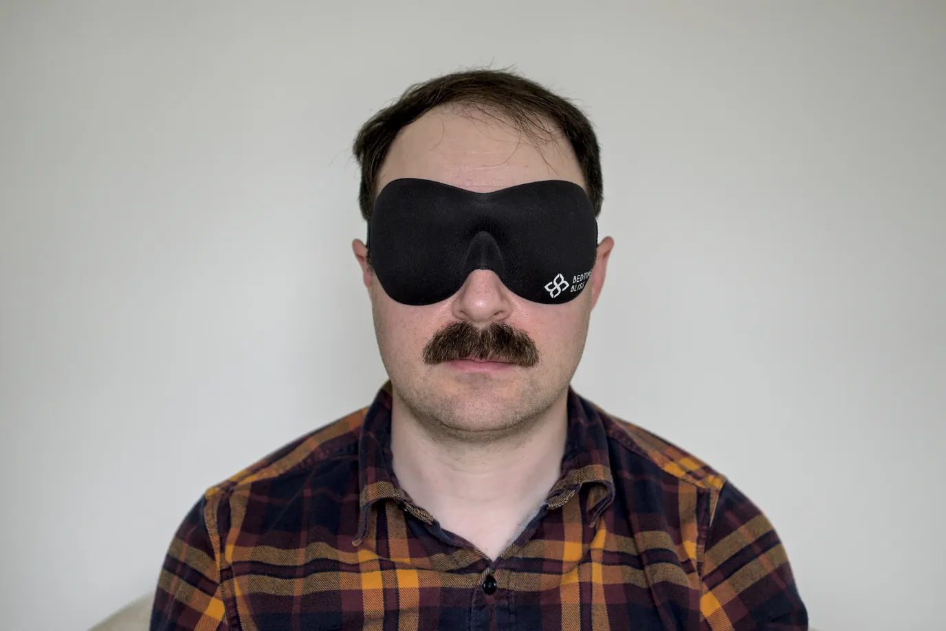 A photo of me wearing a Bedtime Bliss sleep mask